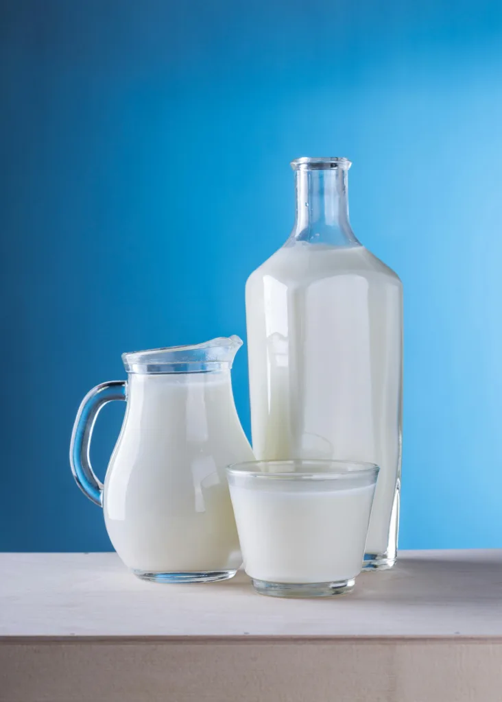 a bottle, a jug and a glass of milk which all would contain casein as its main form of protein.